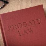 A red book on a table. The book says 'Probate Law' on the front cover.