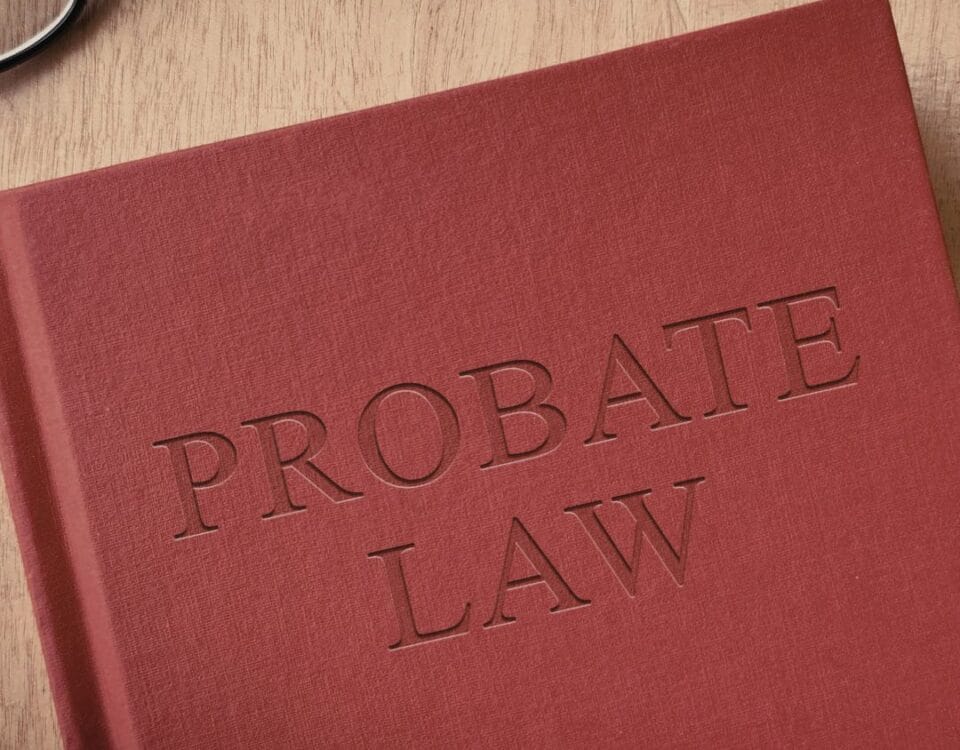 A red book on a table. The book says 'Probate Law' on the front cover.